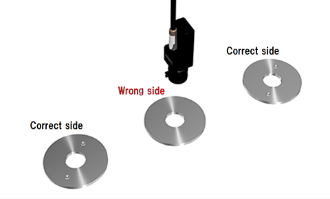 Checking side of the metal disk